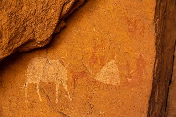 Rock art panel of human figures, cows and a (white) hut, Gaora Hallagana, Ennedi, northeastern Chad