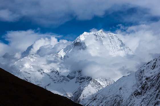 Mount Pang Puchi, 6377m, in clouds, seen from Dharamsala (Larkye Phedi)
