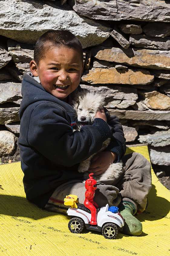 Boy with puppy dog, Sama (Samagaon), Buri Gandaki Valley