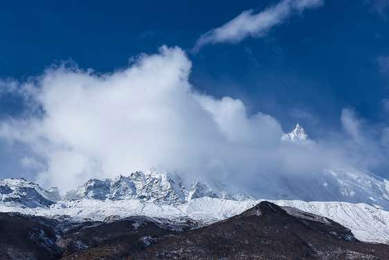 Mount Manaslu, 8163m, in clouds on route from Sama (Samagaon) to Samdu in the Buri Gandaki Valley