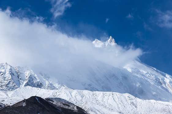 Mount Manaslu, 8163m, in clouds on route from Sama (Samagaon) to Samdu in the Buri Gandaki Valley