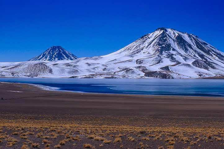 Volcano Chiliques, 5778m, and Cerro Miscanti, 5622m, seen from the Laguna Miscanti