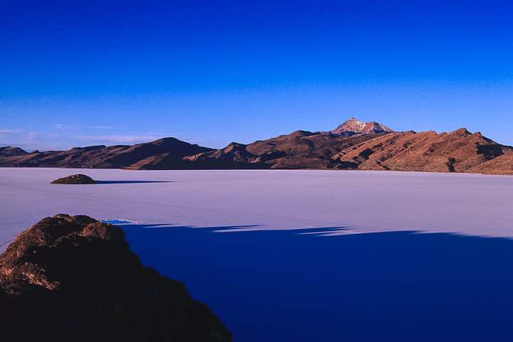 Panoramic view at sunset with volcano Tunupa, 5432m, in the background, Salar de Uyuni