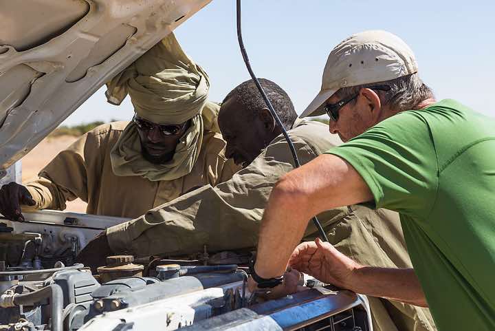 Our drivers Mohammed and Osman try to get the car running again