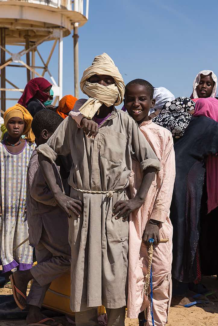 Nomad boy proudly poses in front of the camera