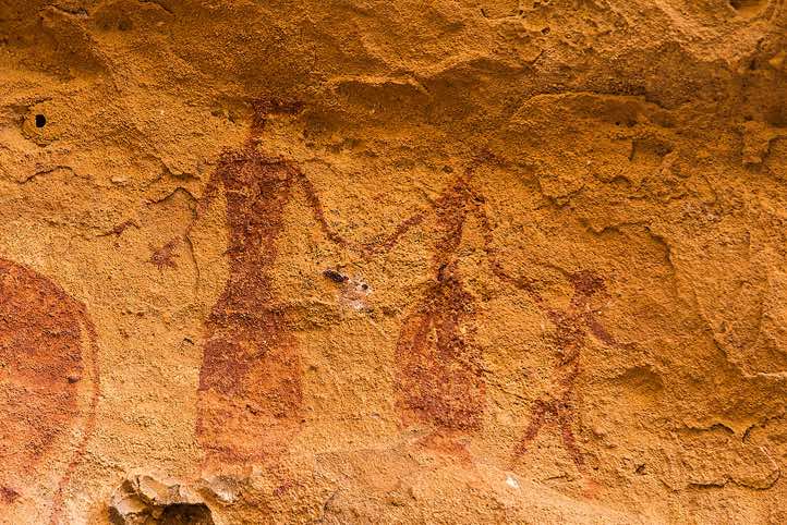 Rock painting of human figures depicting a family of three, Terkei West, Ennedi, northeastern Chad