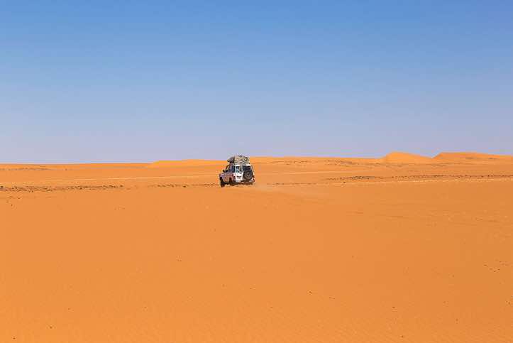 Off-road vehicle in the middle of the desert
