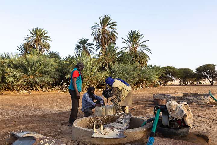 Cook Hassan, driver Al Khali and driver Omar at a well