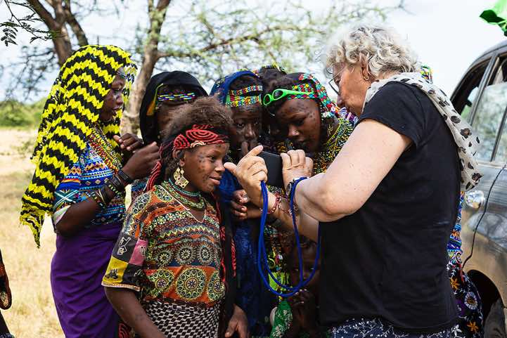 Wodaabe (Bororo) kids gather around Martina's mobile phone, Gerewol festival