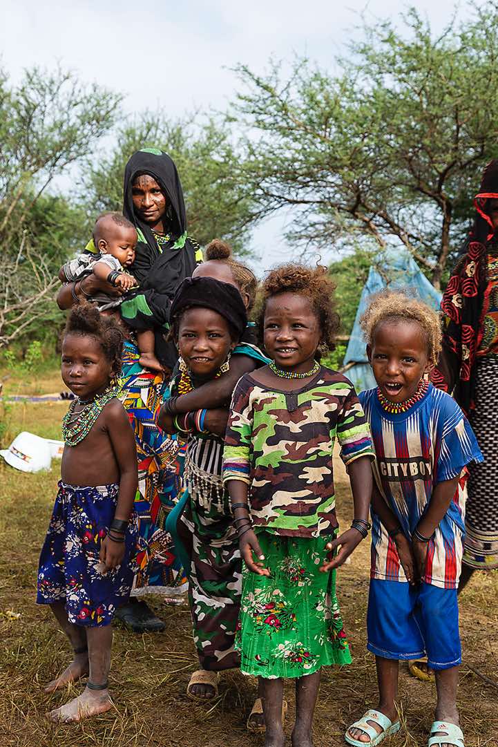 Wodaabe (Bororo) mother and kids at a small camp or wuro that was set up for the Gerewol festival