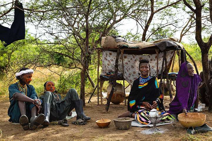 Wodaabe (Bororo) women preparing tea at small camp or wuro that was set up for the Gerewol festival