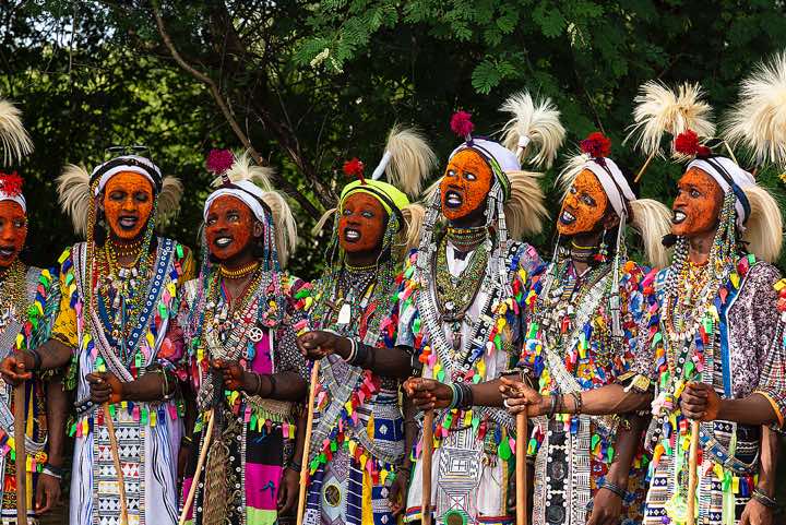Wodaabe (Bororo) men at the Gerewol festival wearing elaborate makeup and clothing