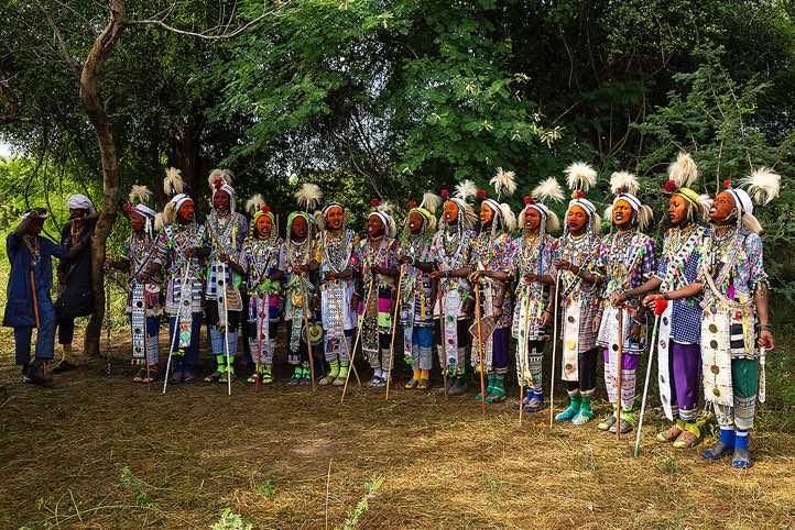 Wodaabe (Bororo) men chanting and dancing in a long line at the Gerewol festival
