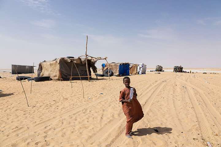 Huts at a well in the desert, 90 kilometres north of Kouba Olanga, Borkou region
