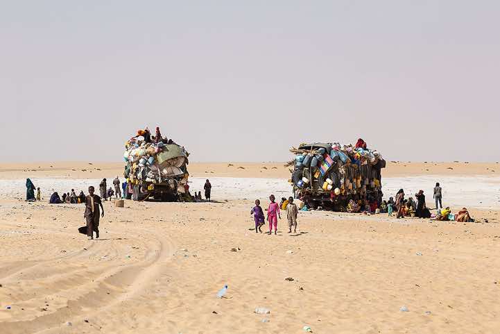 Trucks at a well in the desert, Borkou region