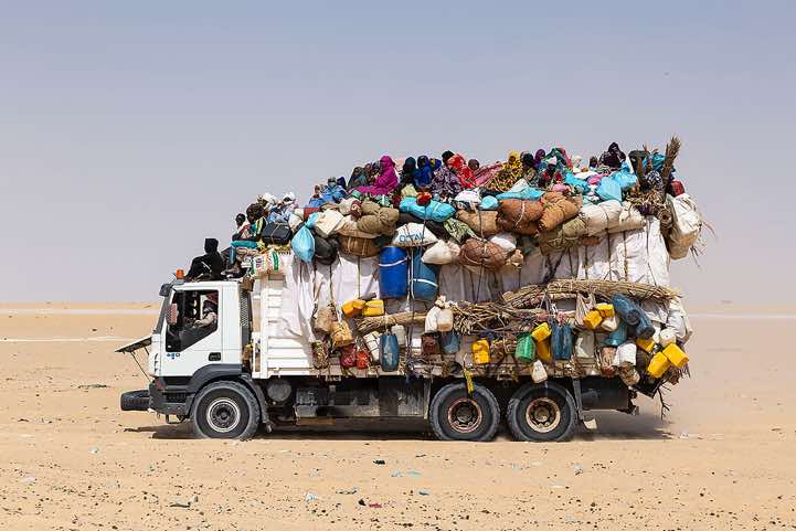 Truck loaded with goods and people in the desert, Borkou region
