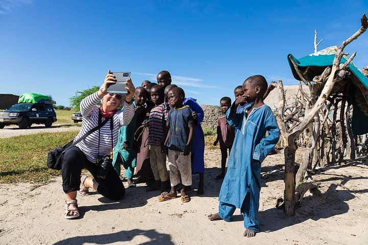 Guide Martina takes selfies during a visit to a village en route to Salal via Moussoro