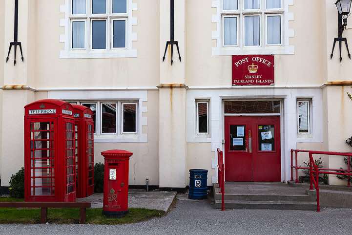 Stanley post office, with British red post and telephone boxes