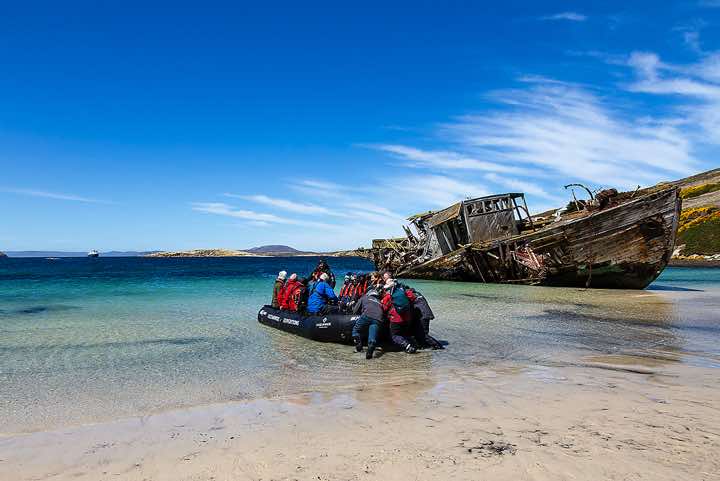 Zodiac on the shore at Coffin’s Harbour, New Island