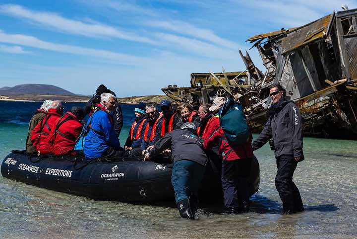 Zodiac on the shore at Coffin’s Harbour, New Island
