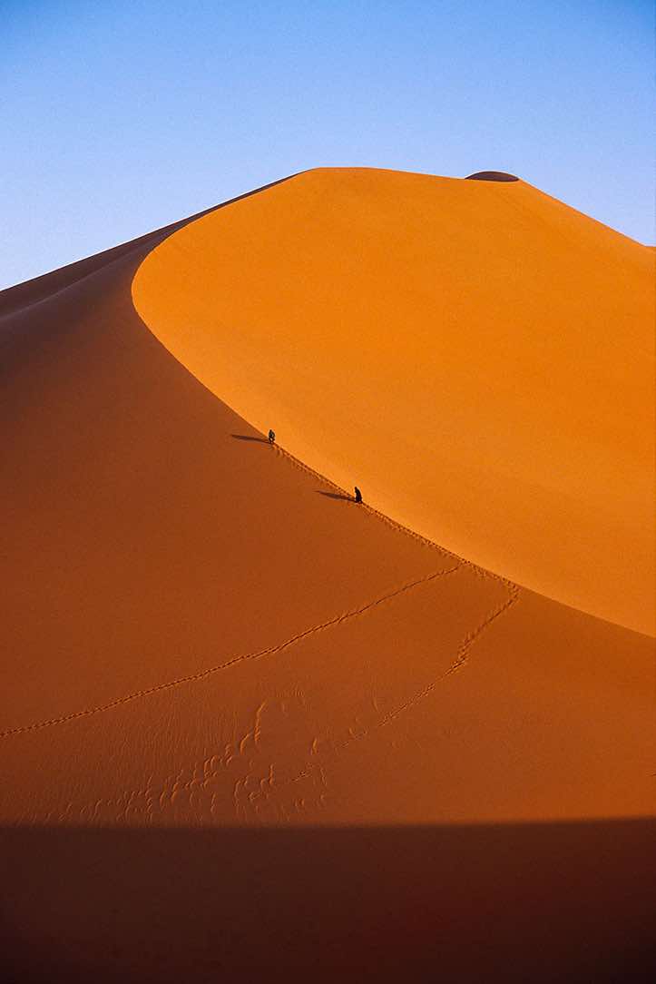 Dune ascent at sunset, near Ghat