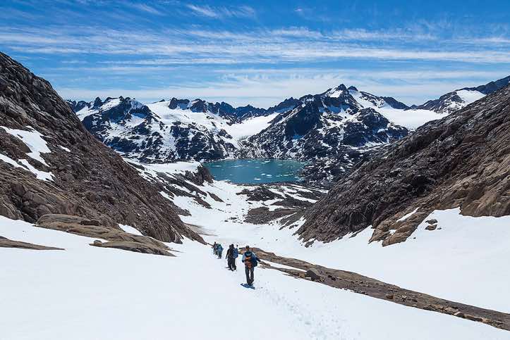 Group descending an icefield near Sangmileq Fjord, Ammassalik Island