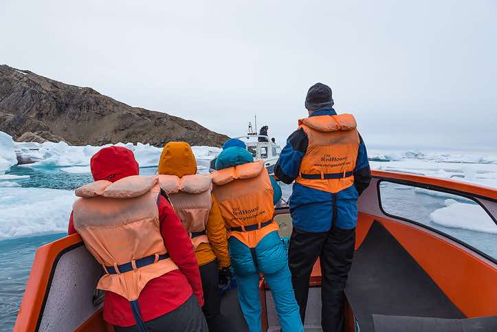 Iceberg watching from a small boat, Ammassalik Island