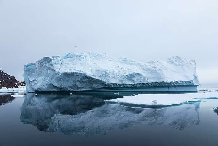Iceberg reflecting in water, Ammassalik Island