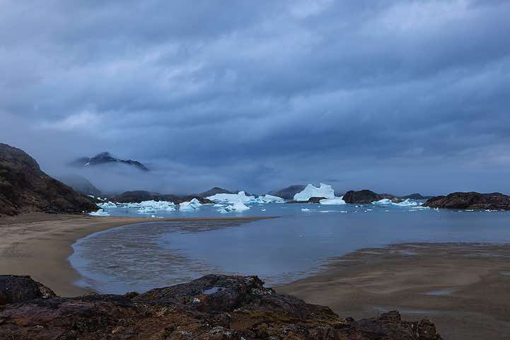 Campsite with icebergs in the background near Sermilik Research Station, Sermilik Fjord, Ammassalik Island