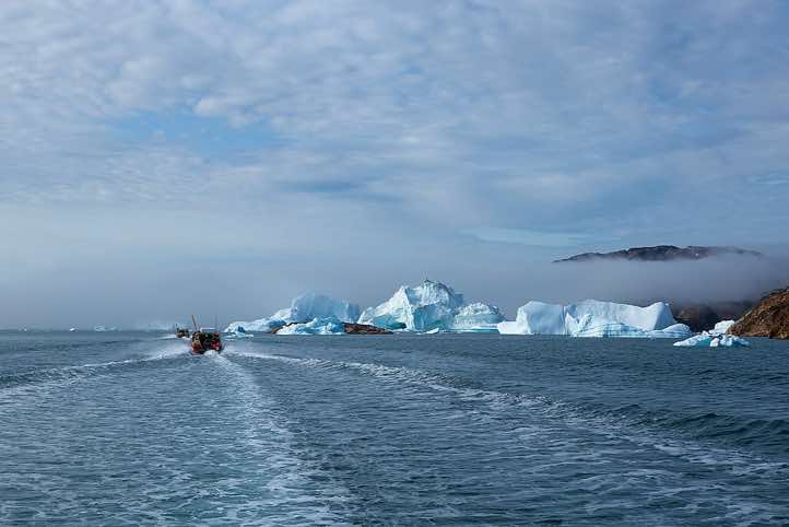 Boats on their way from Tasiilaq to Sermilik Fjord, Ammassalik Island