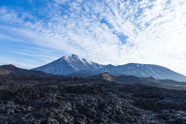 Active Plosky Tolbachik (the Flat Tolbachik, 3085m, r.) and extinct Ostry Tolbachik (the Sharp Tolbachik, 3682m), two joined volcanoes in the south-west part of the Klyuchevskoye plateau 