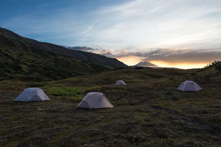 Campsite with Kamen volcano, 4575m, and Bezymyannaya Sopka (or Bezymianny) volcano, 2882m, in the background, around Tolbachik trek, Klyuchevskoy Nature Park