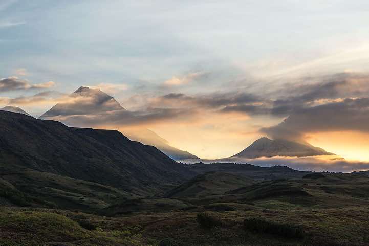 From left: Top of Klyuchevskaya Sopka (or Klyuchevskoy) volcano, 4850m, Kamen volcano, 4575m, and Bezymyannaya Sopka (or Bezymianny) volcano, 2882m, around Tolbachik trek, Klyuchevskoy Nature Park