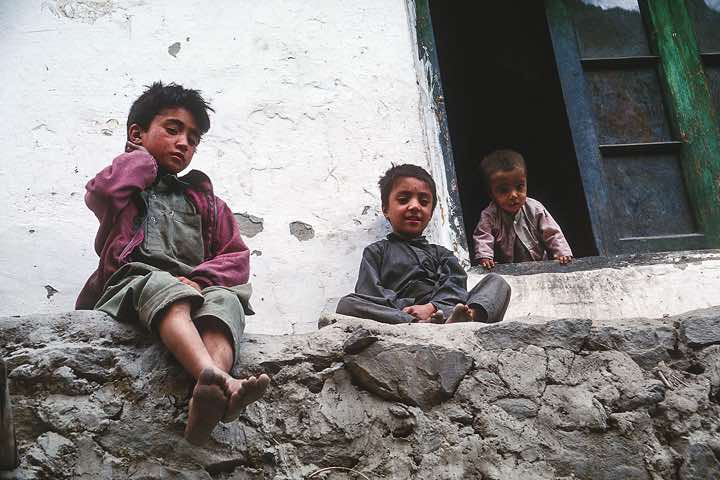 A curious boy stretches his head out of the window, Hushe, Karakoram Mountains
