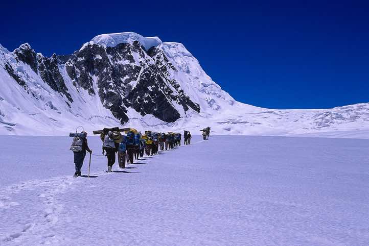 Group of porters approaching Hispar La pass, Karakoram Mountains