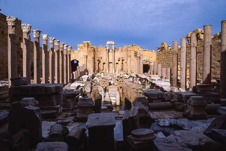 Colossal Aswan granite columns line both sides of the New Basilica