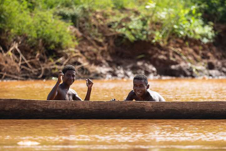 Fishermen with their wooden canoe on the Tsiribihina River, Western Madagascar