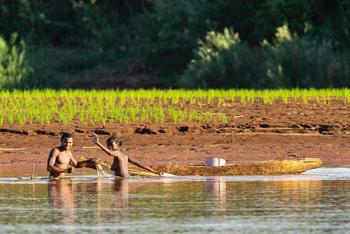 Man and woman fishing in the Tsiribihina River, Western Madagascar