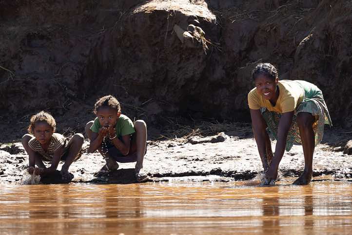 People drinking water of the Tsiribihina River, western Madagascar Western Madagascar