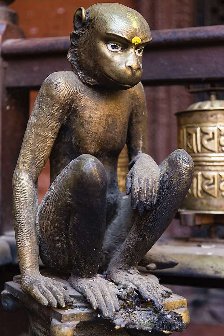 Gilt statue inside the courtyard of the Golden Temple, Patan