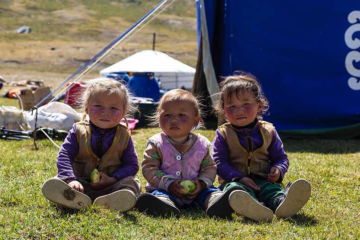 Nomad kids at campsite, Tavan Bogd National Park, Altai Mountains, Western Mongolia