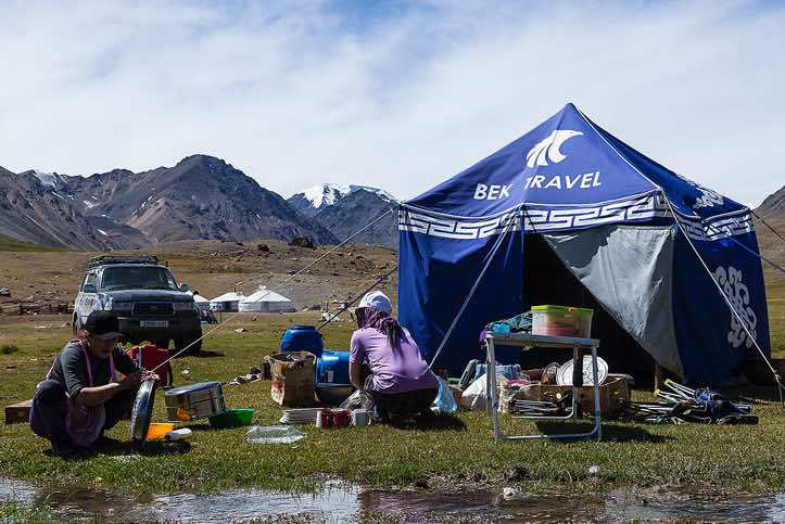 Kitchen crew at campsite, Tavan Bogd National Park, Altai Mountains, Western Mongolia