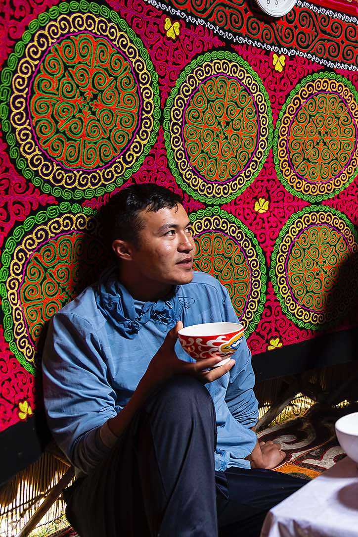Local guide Daulet inside a yurt, Tavan Bogd National Park, Altai Mountains, Western Mongolia