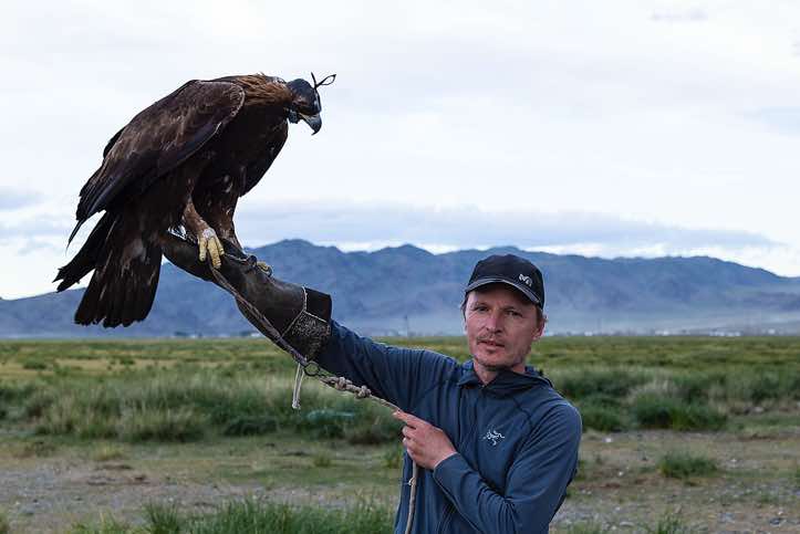 The photographer with an eagle, Altai Mountains, Western Mongolia