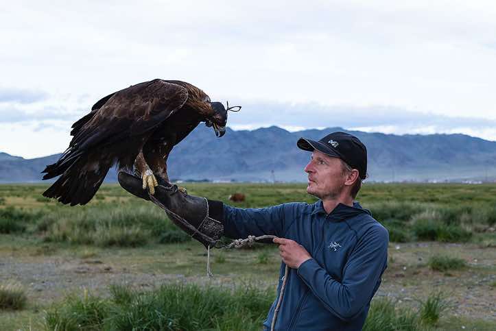 The photographer with an eagle, Altai Mountains, Western Mongolia