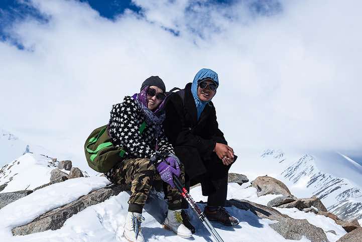 Local guide Daulet and cook Bota on top of Malchin Peak (4050m), Tavan Bogd National Park, Altai Mountains, Western Mongolia