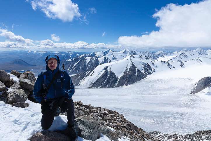 The photographer on top of Malchin Peak (4050m), Tavan Bogd National Park, Altai Mountains, Western Mongolia