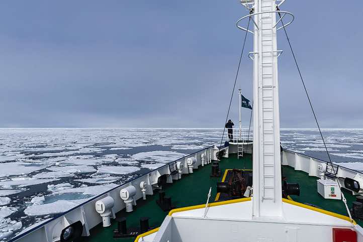 The expedition vessel Plancius moves slowly through the ice floes
