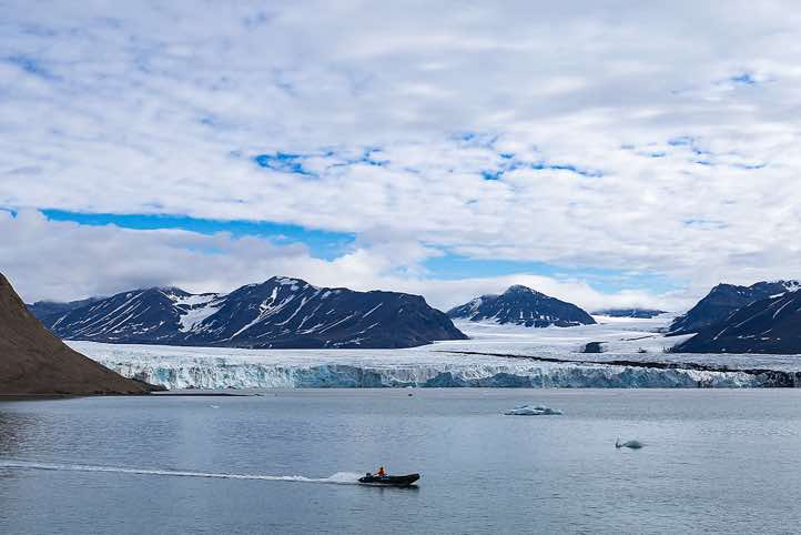Osbornebreen and Vintervegen glaciers with Zodiac in the foreground, St. Jonsfjorden, Oscar II Land