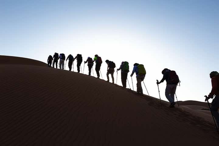 Hiking group in the sand dunes, silhouette, desert landscape, Rub al Khali, Empty Quarter, Dhofar region
